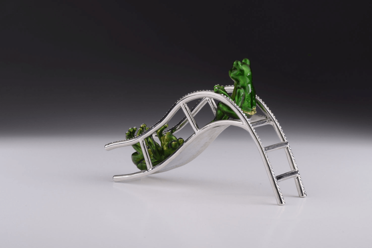 Two Frogs Riding Slide  